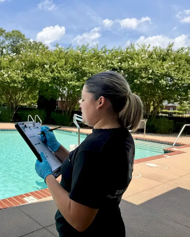 E3R team lead reviewing a checklist on a clipboard